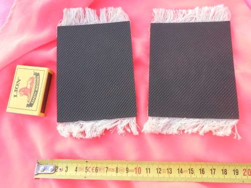 Carpet place-mats or may be suitable as Doll`s-house-sized carpets.