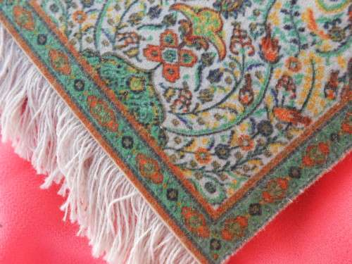 Carpet place-mats or may be suitable as Doll`s-house-sized carpets.