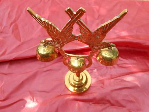 Brass birds on a stand.