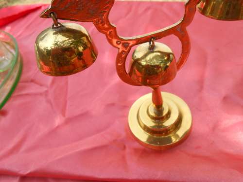 Brass birds on a stand.