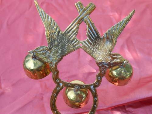 Brass birds on a stand.