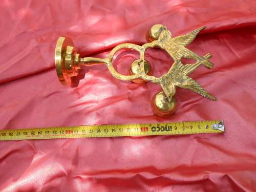 Brass birds on a stand.