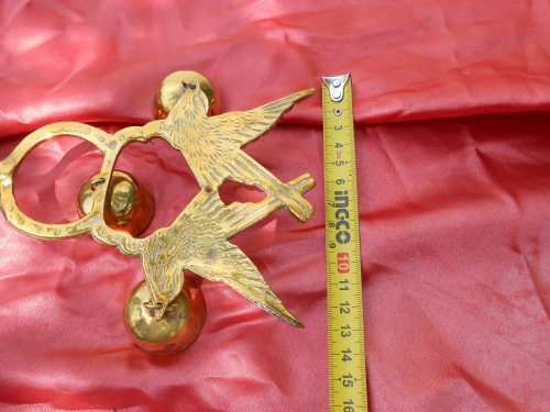 Brass birds on a stand.