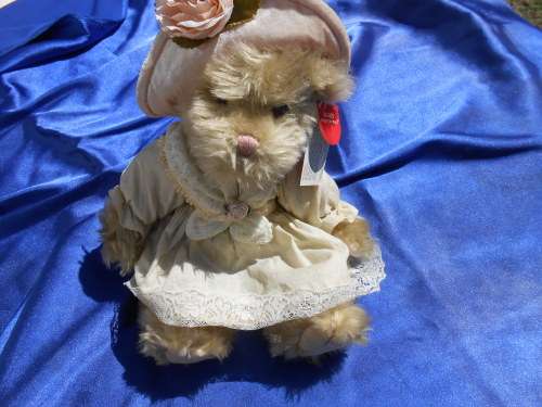 Russ Teddy bear named `Bronwyn`.  Sales label still attached.