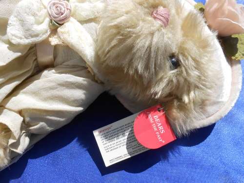 Russ Teddy bear named `Bronwyn`.  Sales label still attached.