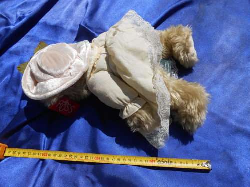 Russ Teddy bear named `Bronwyn`.  Sales label still attached.
