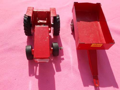 Strike tin-plate tractor and trailer.  Made in South Africa.  Condition as per photos.