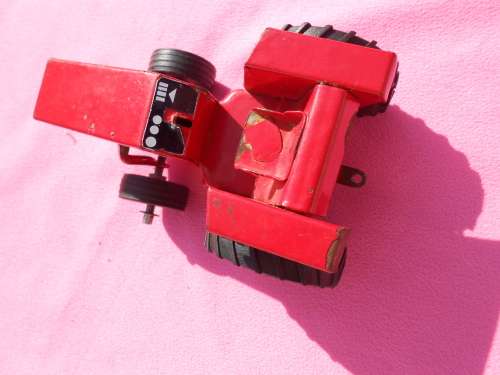 Strike tin-plate tractor and trailer.  Made in South Africa.  Condition as per photos.