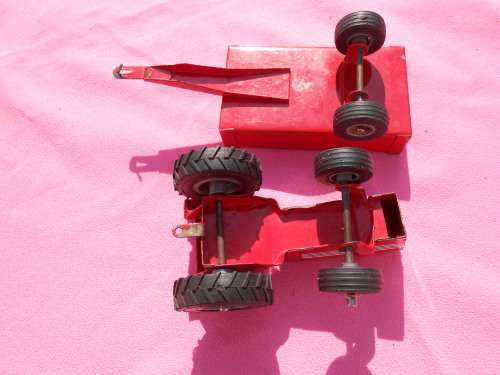 Strike tin-plate tractor and trailer.  Made in South Africa.  Condition as per photos.