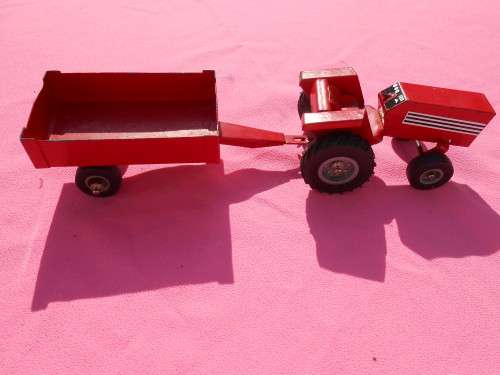 Strike tin-plate tractor and trailer.  Made in South Africa.  Condition as per photos.