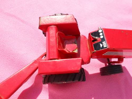 Strike tin-plate tractor and trailer.  Made in South Africa.  Condition as per photos.