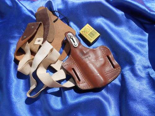Leather pistol/gun holsters.