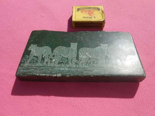 Small green-stone carving of a cheetahs - I am guessing it is Verdite.