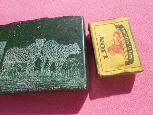 Small green-stone carving of a cheetahs - I am guessing it is Verdite.