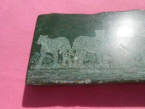 Small green-stone carving of a cheetahs - I am guessing it is Verdite.