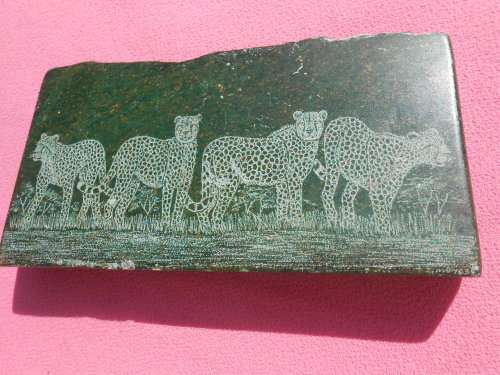 Small green-stone carving of a cheetahs - I am guessing it is Verdite.