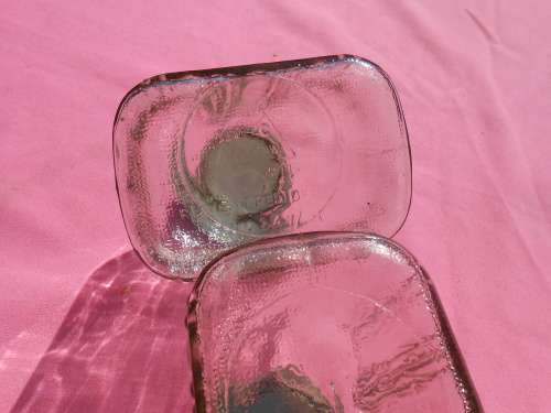 Ribbed glass jars with metal lids.