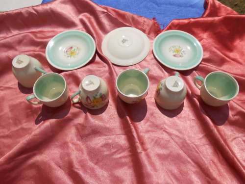 Susie Cooper.  Three saucers and six, SMALL, coffee cups.  No chips, cracks or repairs.