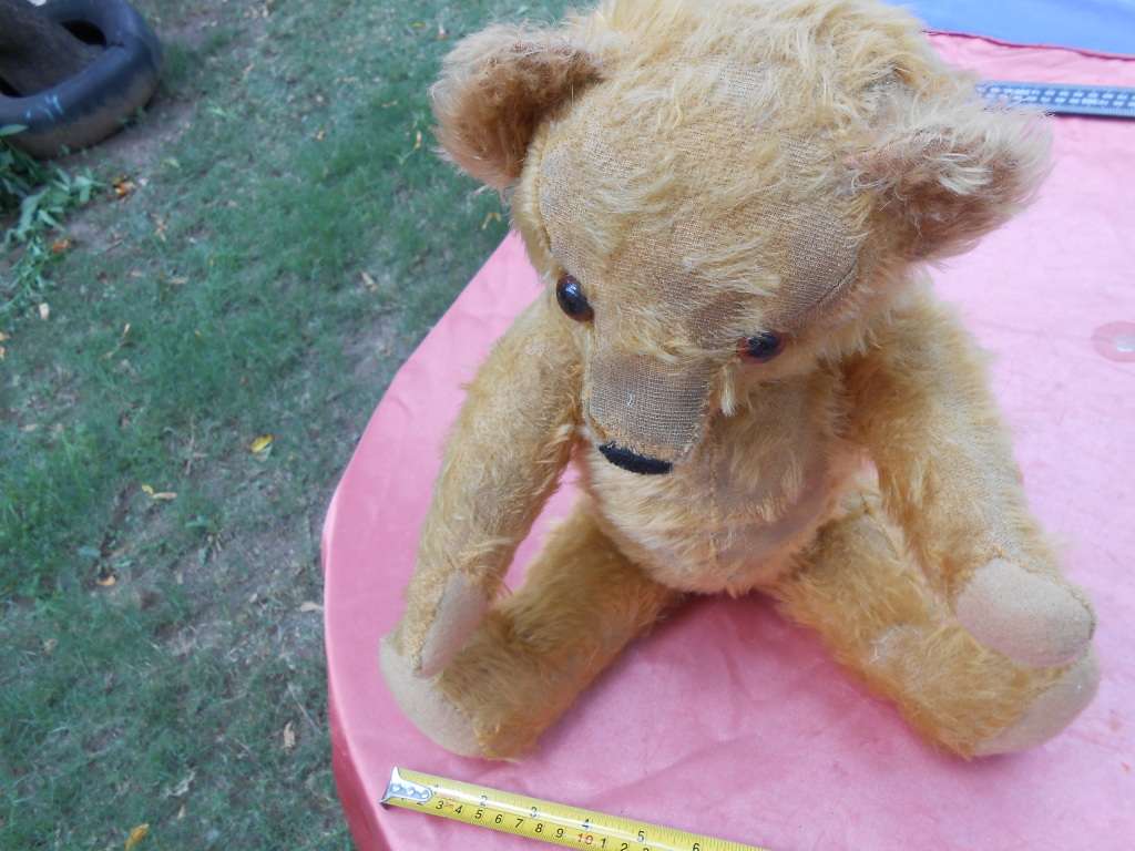 Teddy bear. Much-loved condition - one ear has been sewn back on - as per photo.