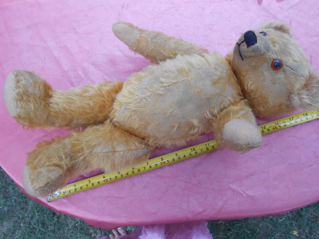 Teddy bear. Much-loved condition - one ear has been sewn back on - as per photo.