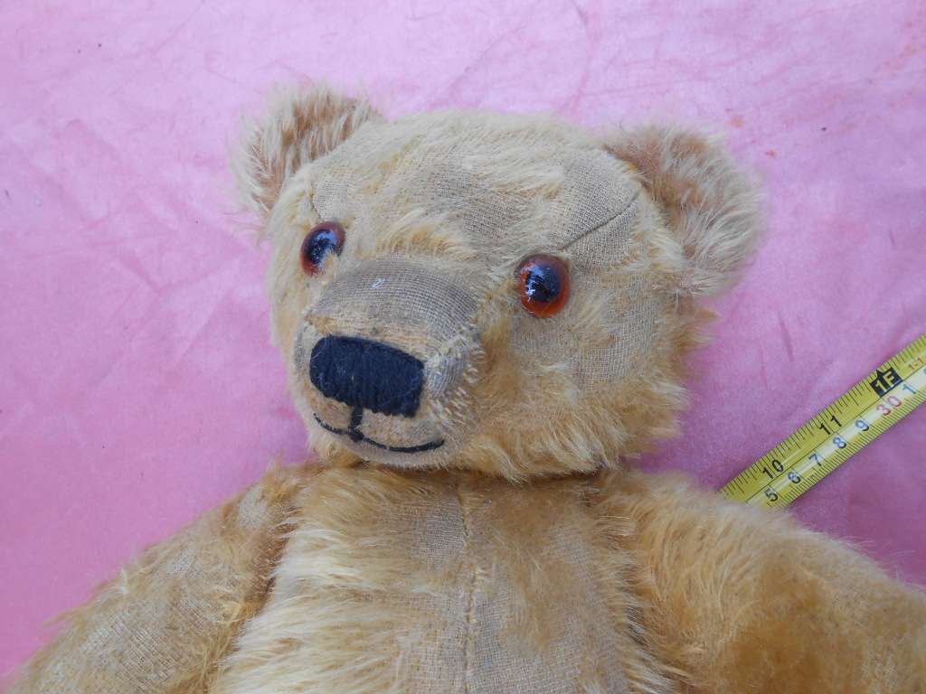 Teddy bear. Much-loved condition - one ear has been sewn back on - as per photo.