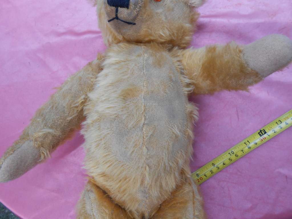 Teddy bear. Much-loved condition - one ear has been sewn back on - as per photo.