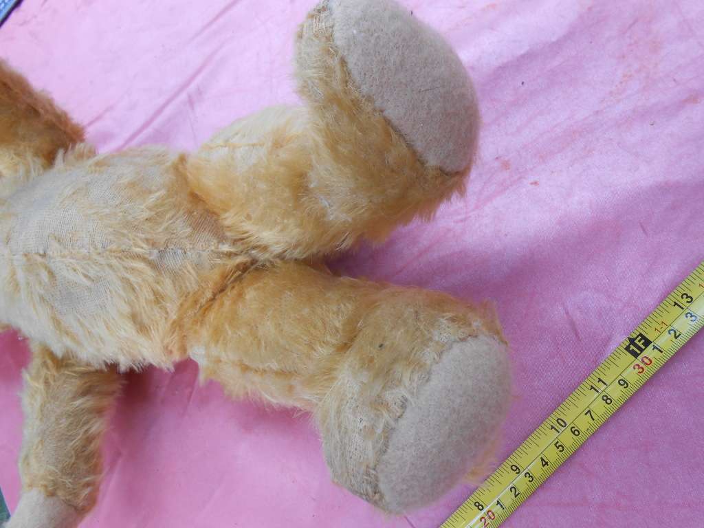 Teddy bear. Much-loved condition - one ear has been sewn back on - as per photo.
