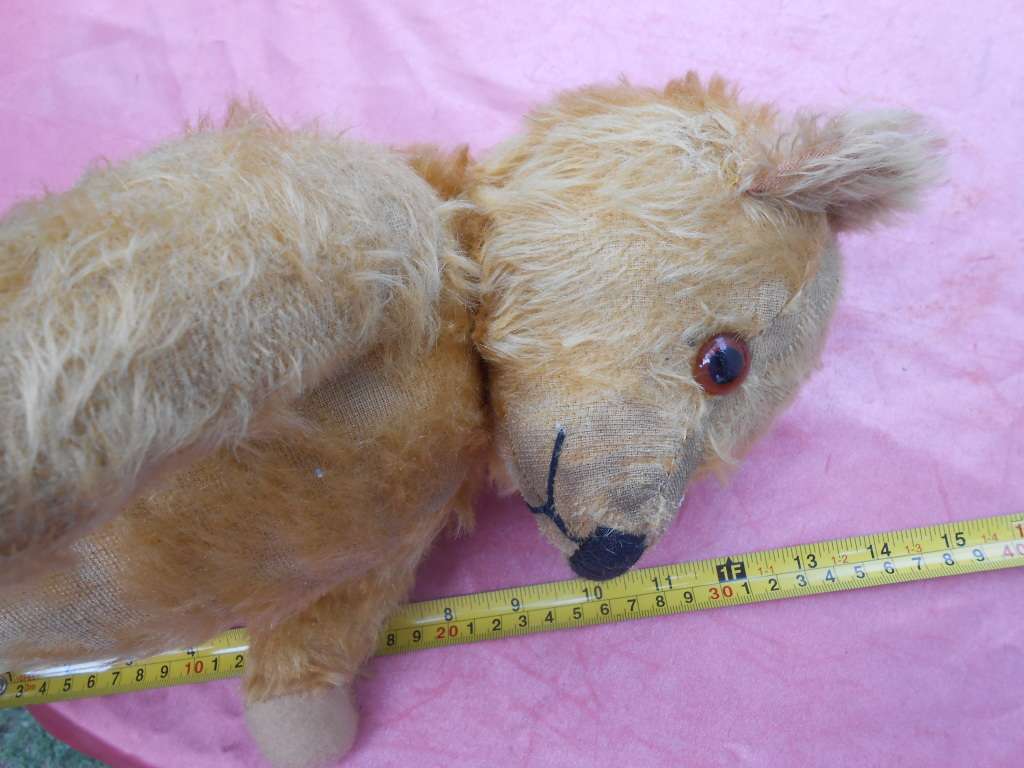 Teddy bear. Much-loved condition - one ear has been sewn back on - as per photo.
