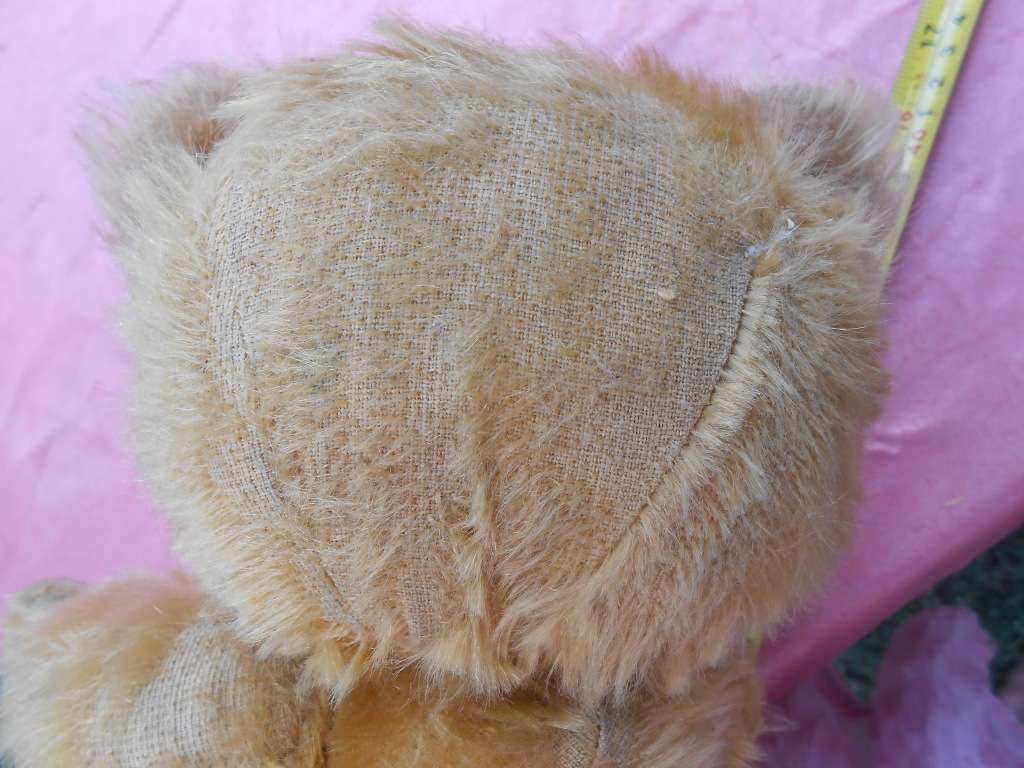Teddy bear. Much-loved condition - one ear has been sewn back on - as per photo.