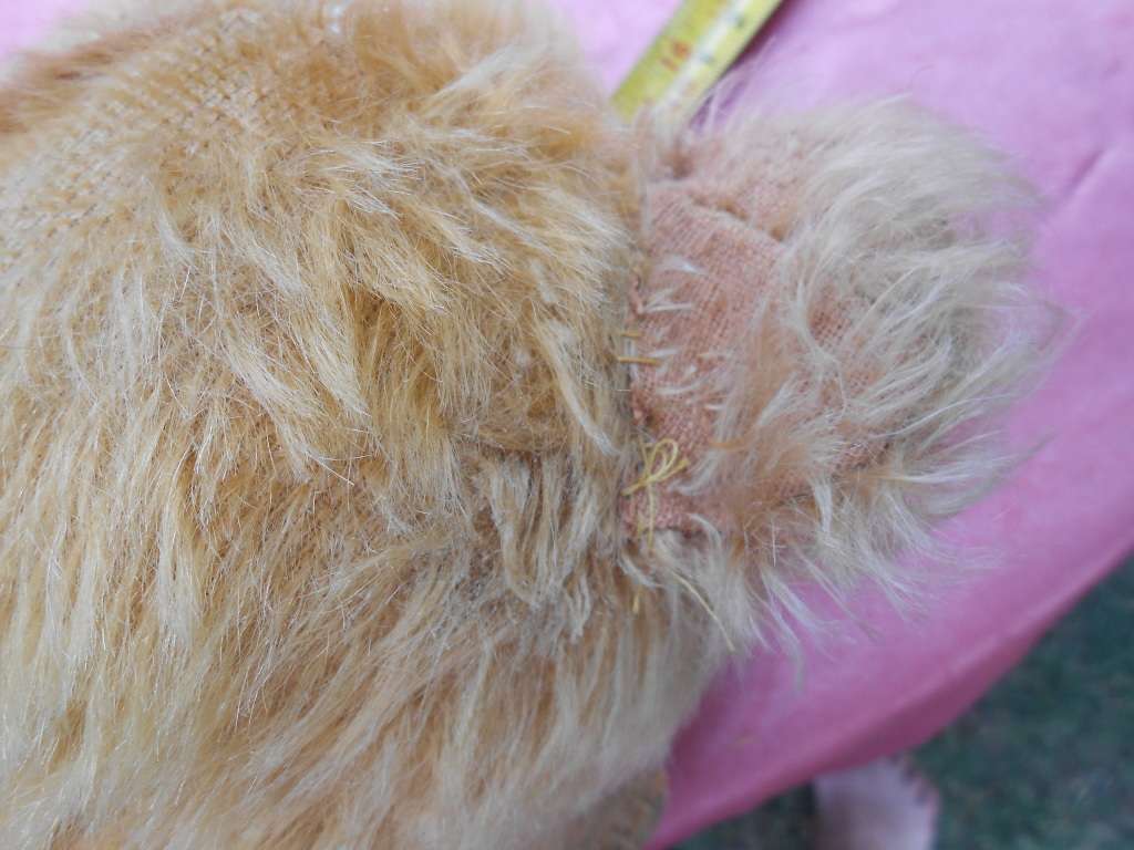 Teddy bear. Much-loved condition - one ear has been sewn back on - as per photo.