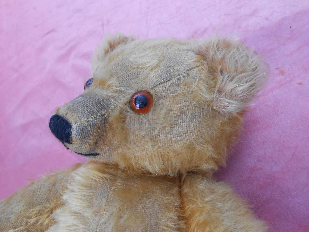 Teddy bear. Much-loved condition - one ear has been sewn back on - as per photo.
