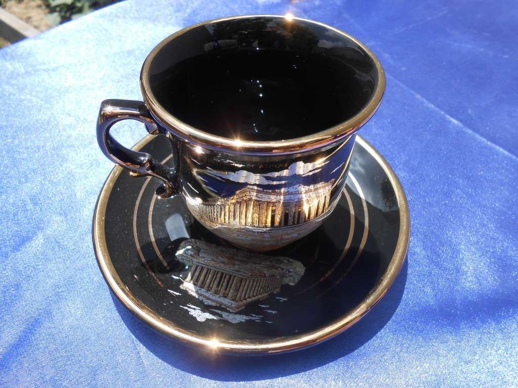Small cup and saucer, stamped: D. Strigos.  24k gold trim.  Made in Greece.