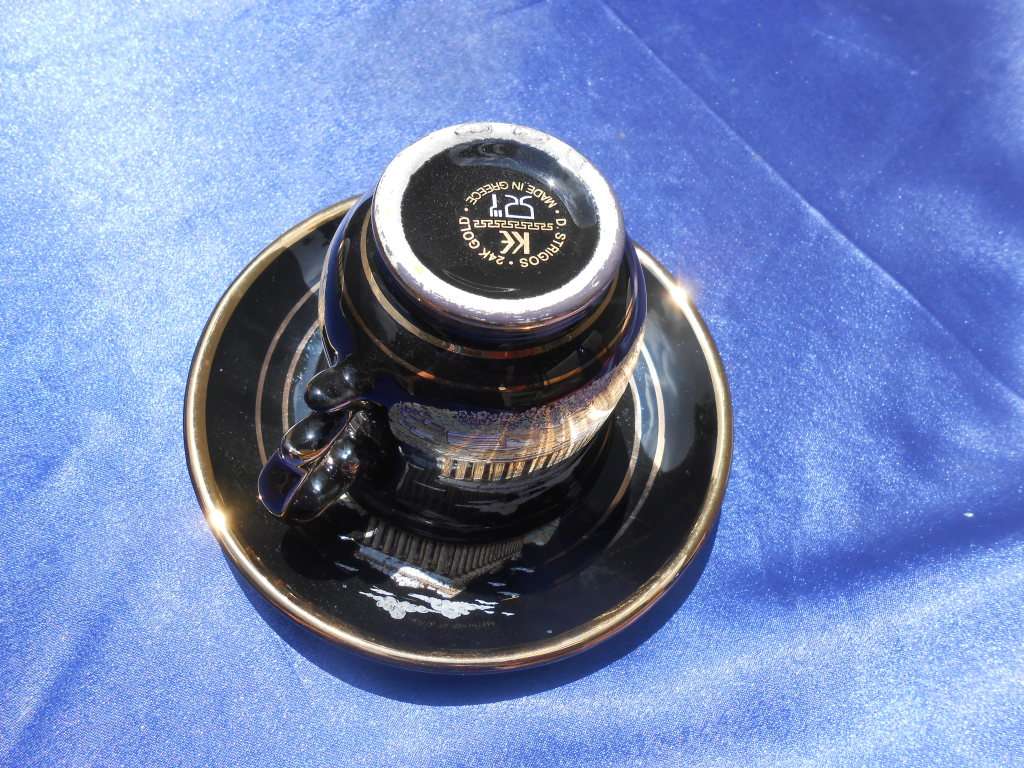 Small cup and saucer, stamped: D. Strigos.  24k gold trim.  Made in Greece.
