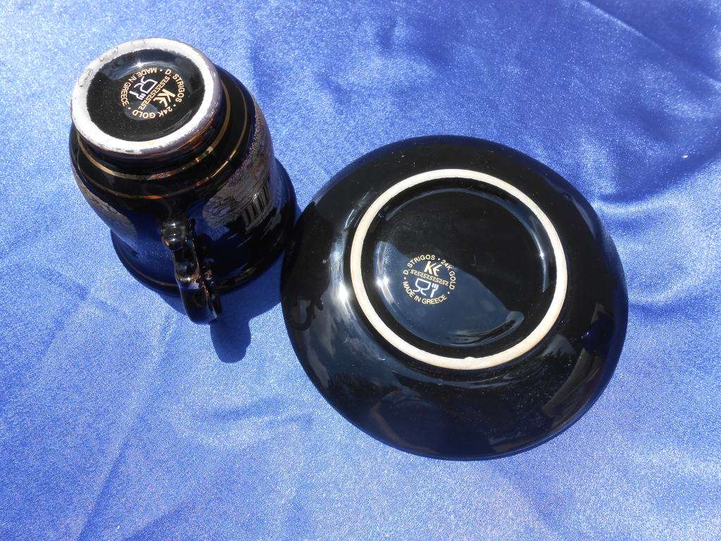 Small cup and saucer, stamped: D. Strigos.  24k gold trim.  Made in Greece.