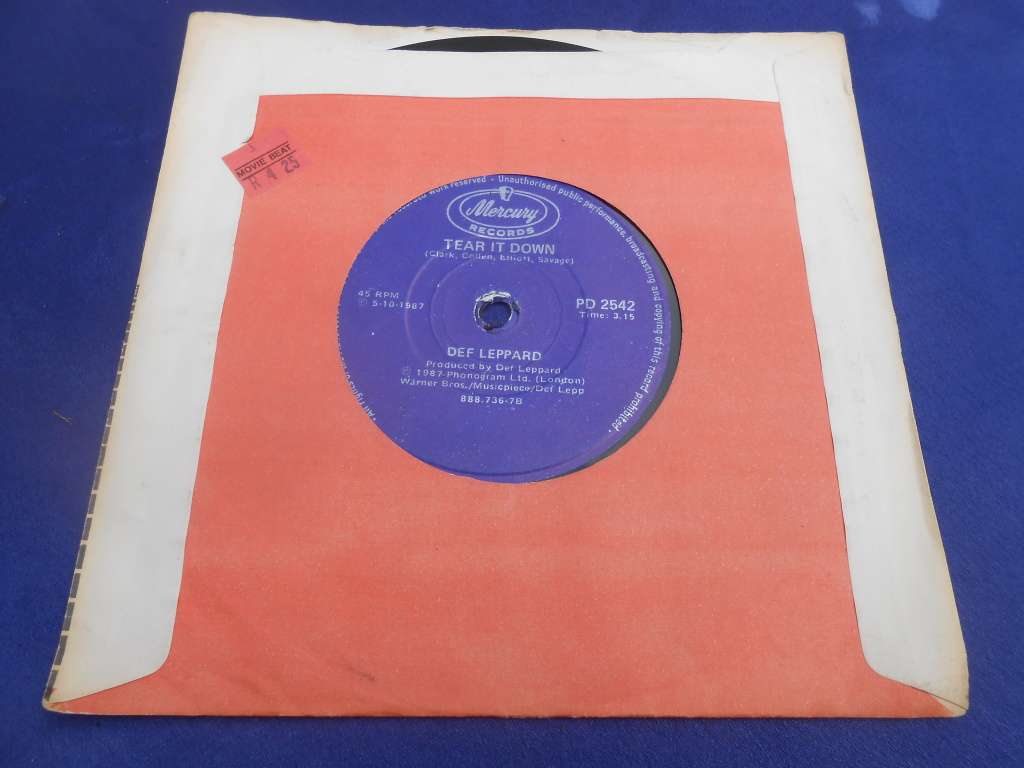 Vinyl 7` single.  Def Leppard.  Tear it down & Animal. VG+ VG+