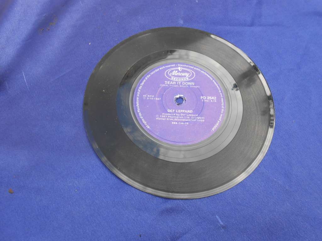 Vinyl 7` single.  Def Leppard.  Tear it down & Animal. VG+ VG+