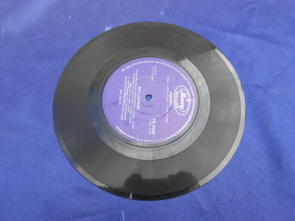 Vinyl 7` single.  Def Leppard.  Tear it down & Animal. VG+ VG+