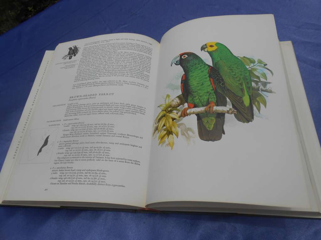 `Parrots of the World`  Second Edition.  Hard cover.  J.M. Forshaw.  A heavy book.