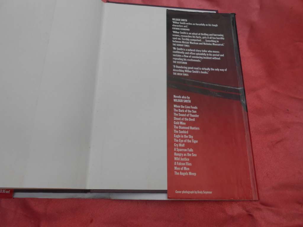 `The Leopard Hunts in Darkness`  Wilbur Smith.  Hard cover.