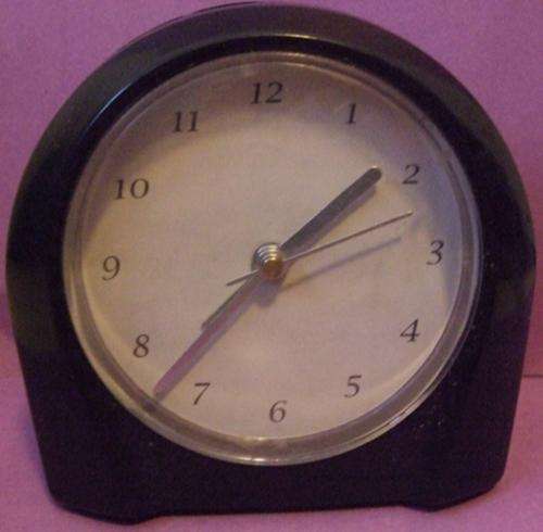 Small Black plastic bedside alarm clock