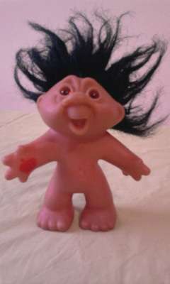 Troll with apple on its hand