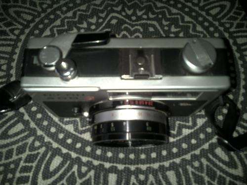 Vintage Ricoh 500G camera with adjustable lense. Auto timer. Still in working order.