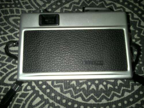 Vintage Ricoh 500G camera with adjustable lense. Auto timer. Still in working order.