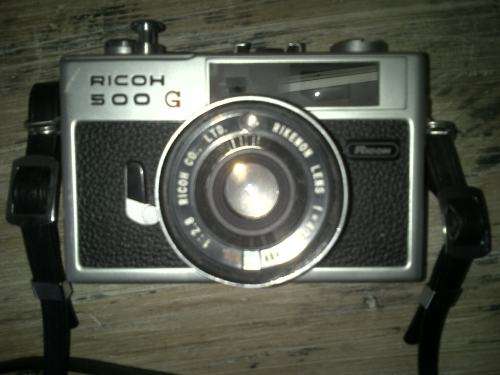 Vintage Ricoh 500G camera with adjustable lense. Auto timer. Still in working order.
