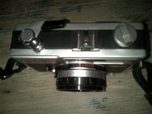 Vintage Ricoh 500G camera with adjustable lense. Auto timer. Still in working order.