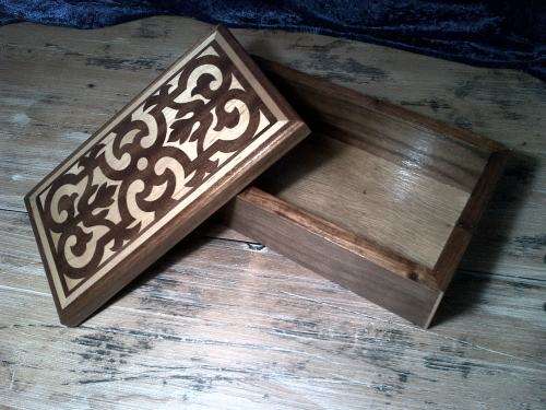 Wooden jewelery or trinket  box with dark and light  wood inlay.