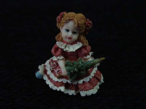 Vintage resin figurine of a Girl with an Umbrella