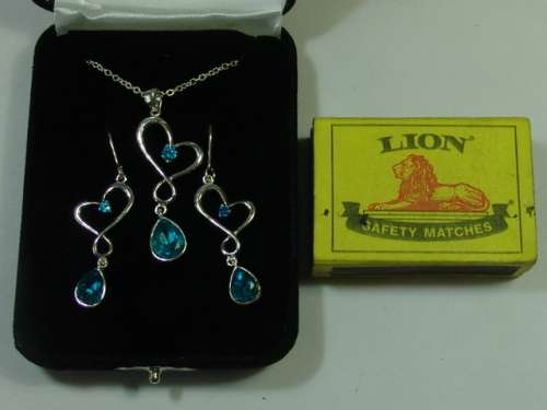 Vintage silver tone Necklace and matching Earring set with light blue stones - original display case