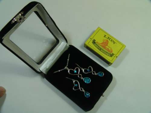 Vintage silver tone Necklace and matching Earring set with light blue stones - original display case