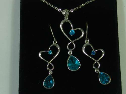 Vintage silver tone Necklace and matching Earring set with light blue stones - original display case